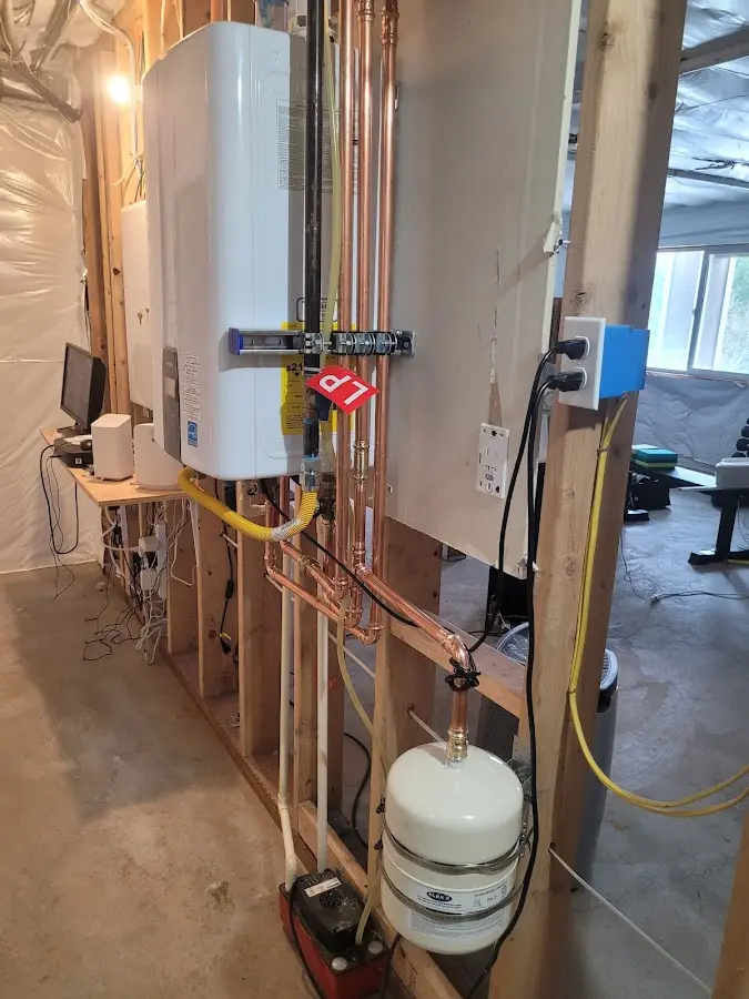 Licensed plumber repairing a kitchen sink in Madawaska